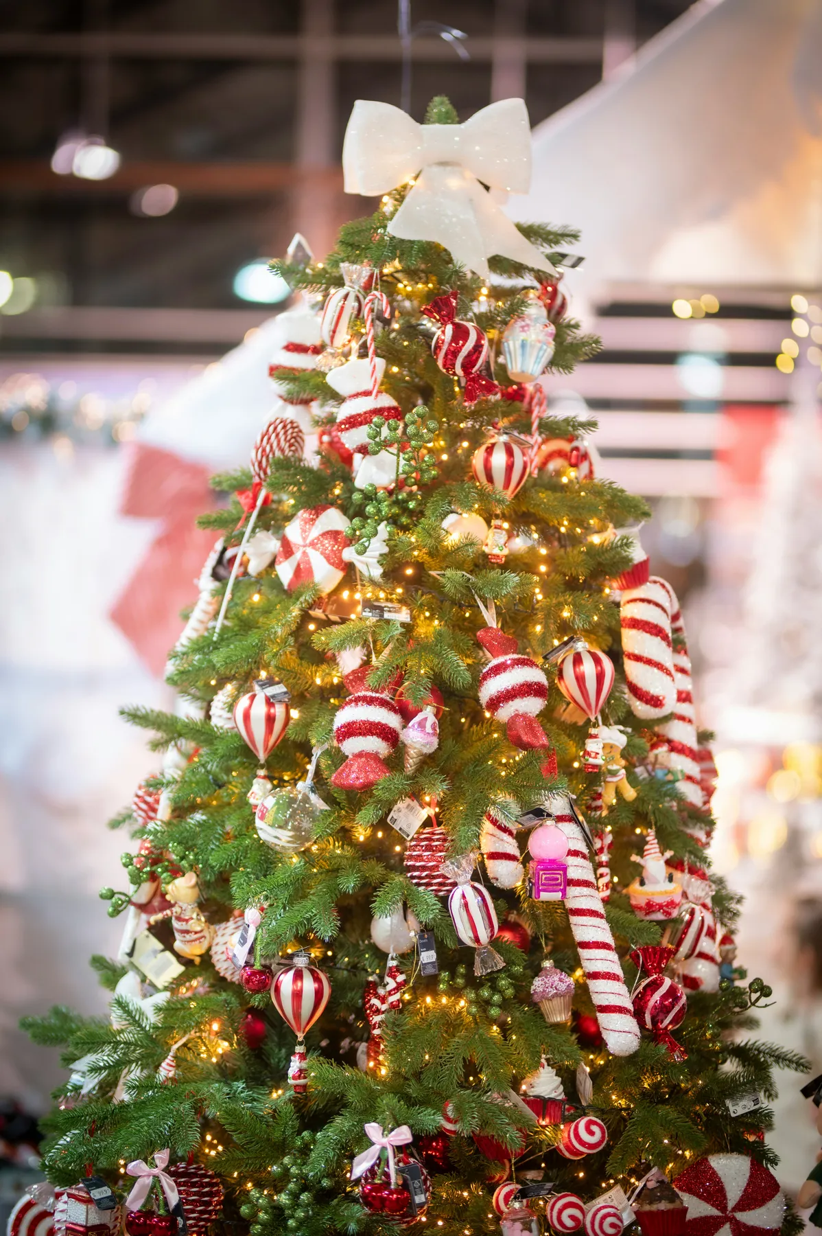 A decorated christmas tree with red and white ornaments