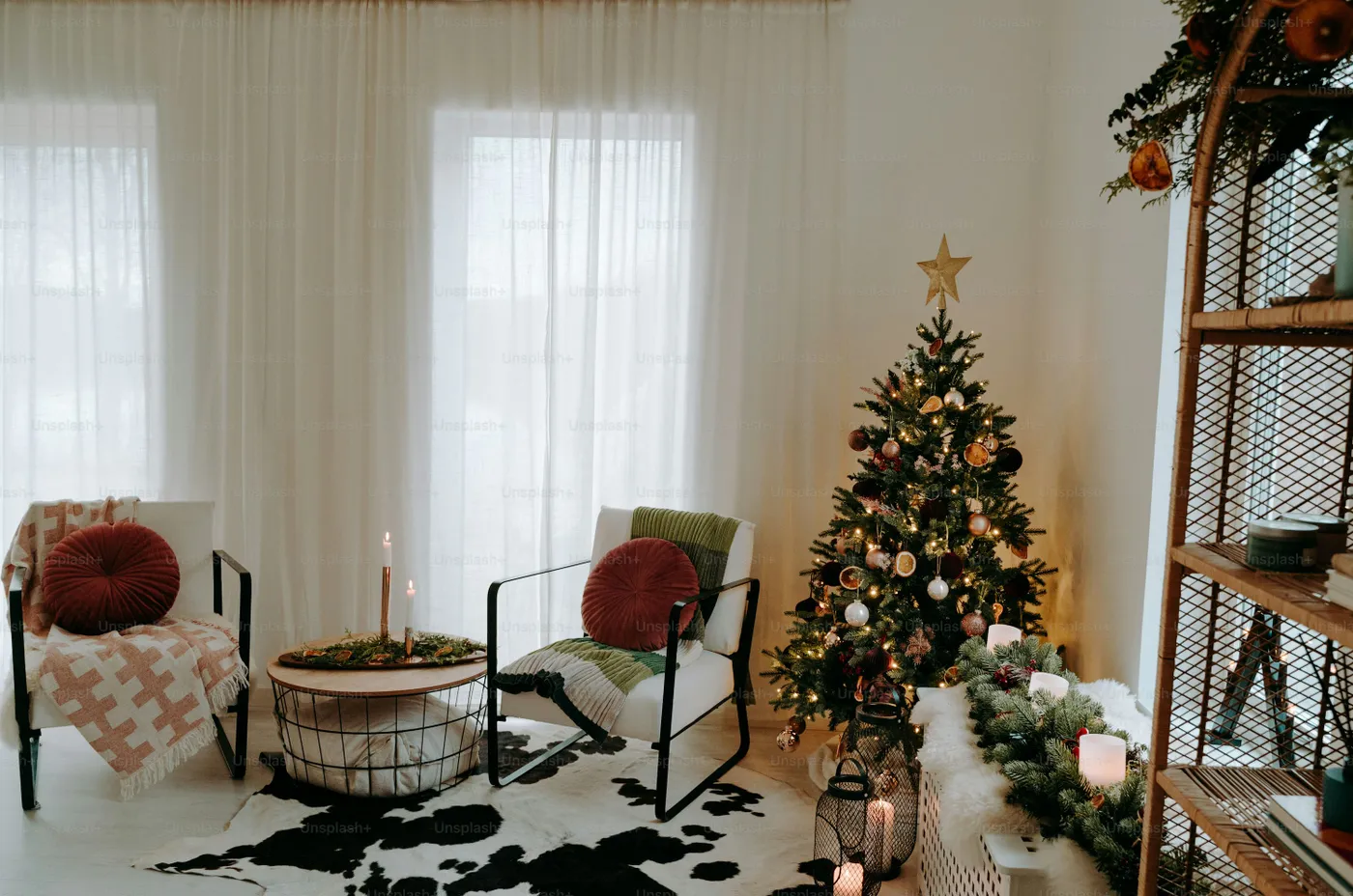 A living room filled with furniture and a christmas tree - Photo on Unsplash+