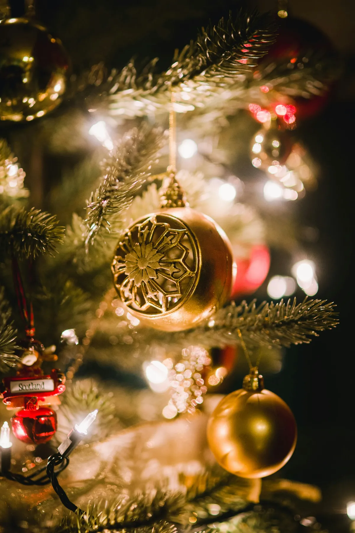 Big Golden Ornament Hanging on the Christmas Tree