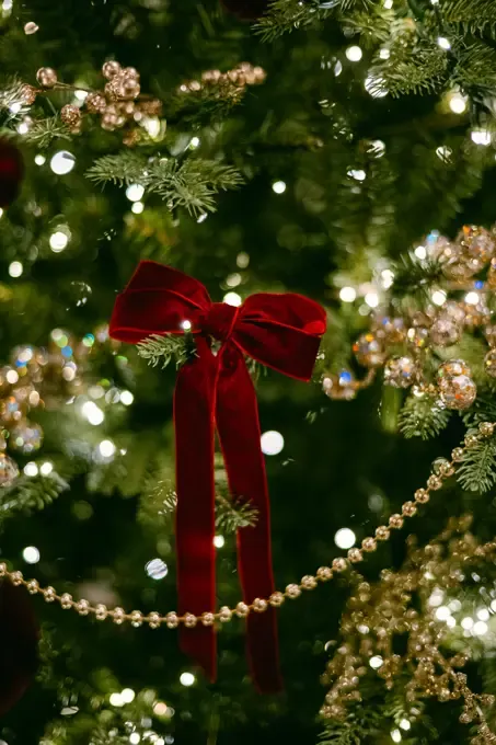 Christmas golden tree with baubles in blur lights… | Stock Photo -  SuperStock