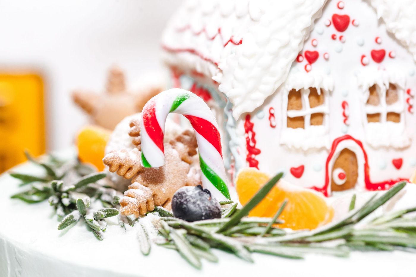 Close-up of a gingerbread house decorated with candy, perfect for Christmas holidays.