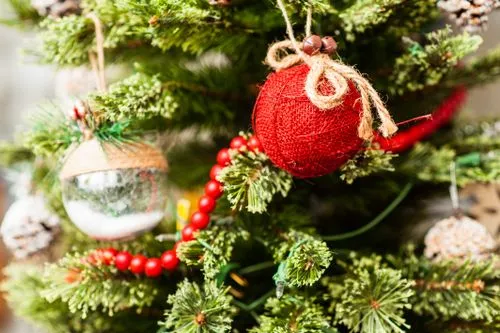 Close-Up of Ornaments Hanging on a Christmas Tree · Free Stock Photo