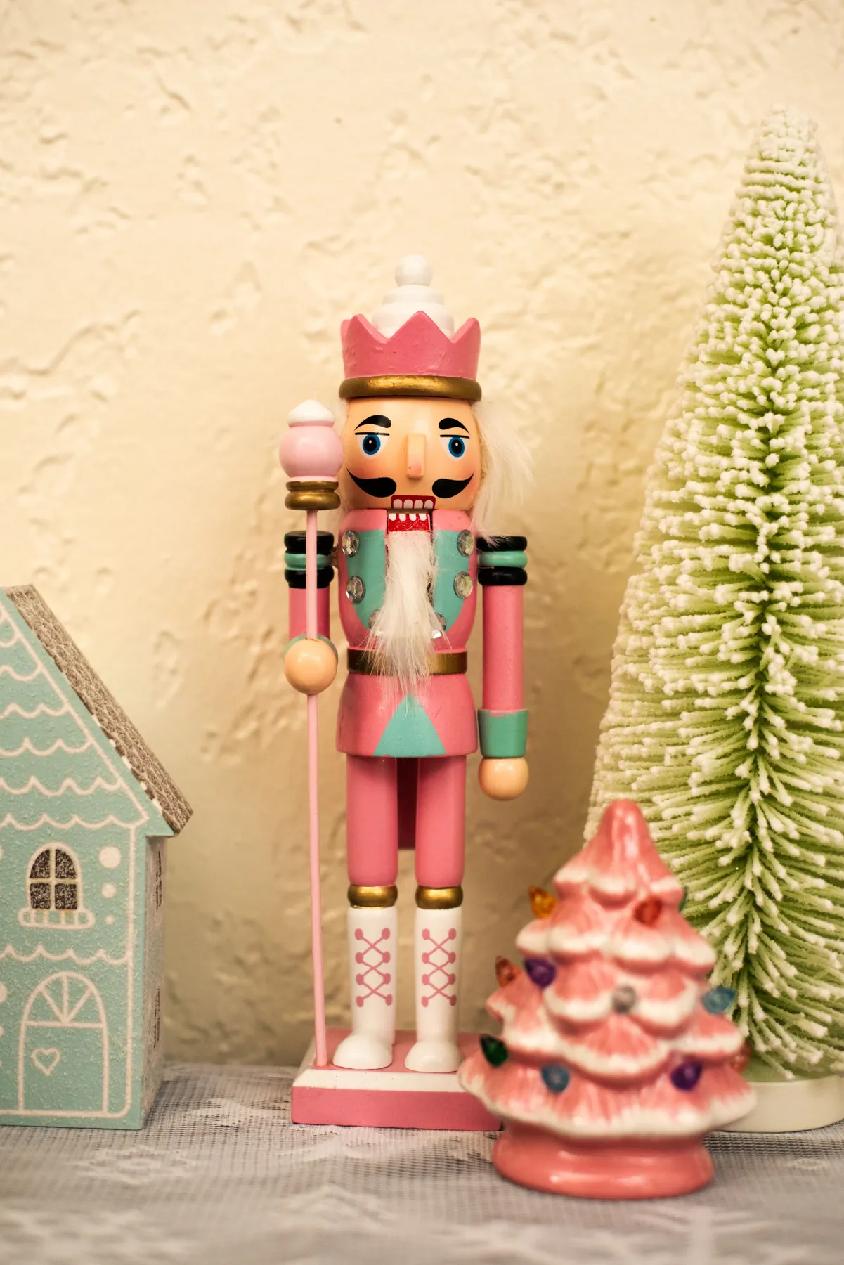 Festive nutcracker and holiday decor with pastel colors.