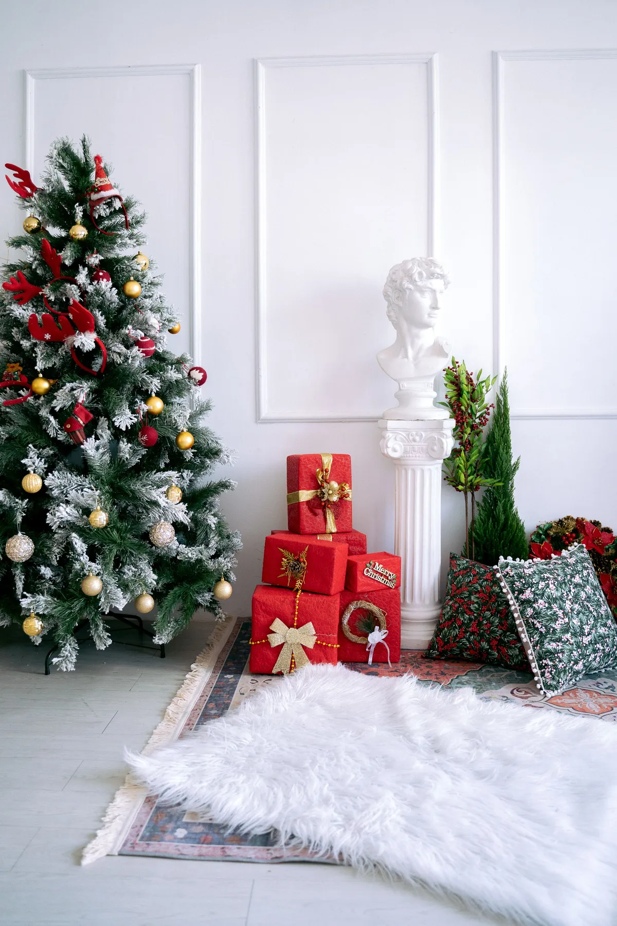 Festive room with Christmas tree, gifts, and classical decor for holiday ambiance.