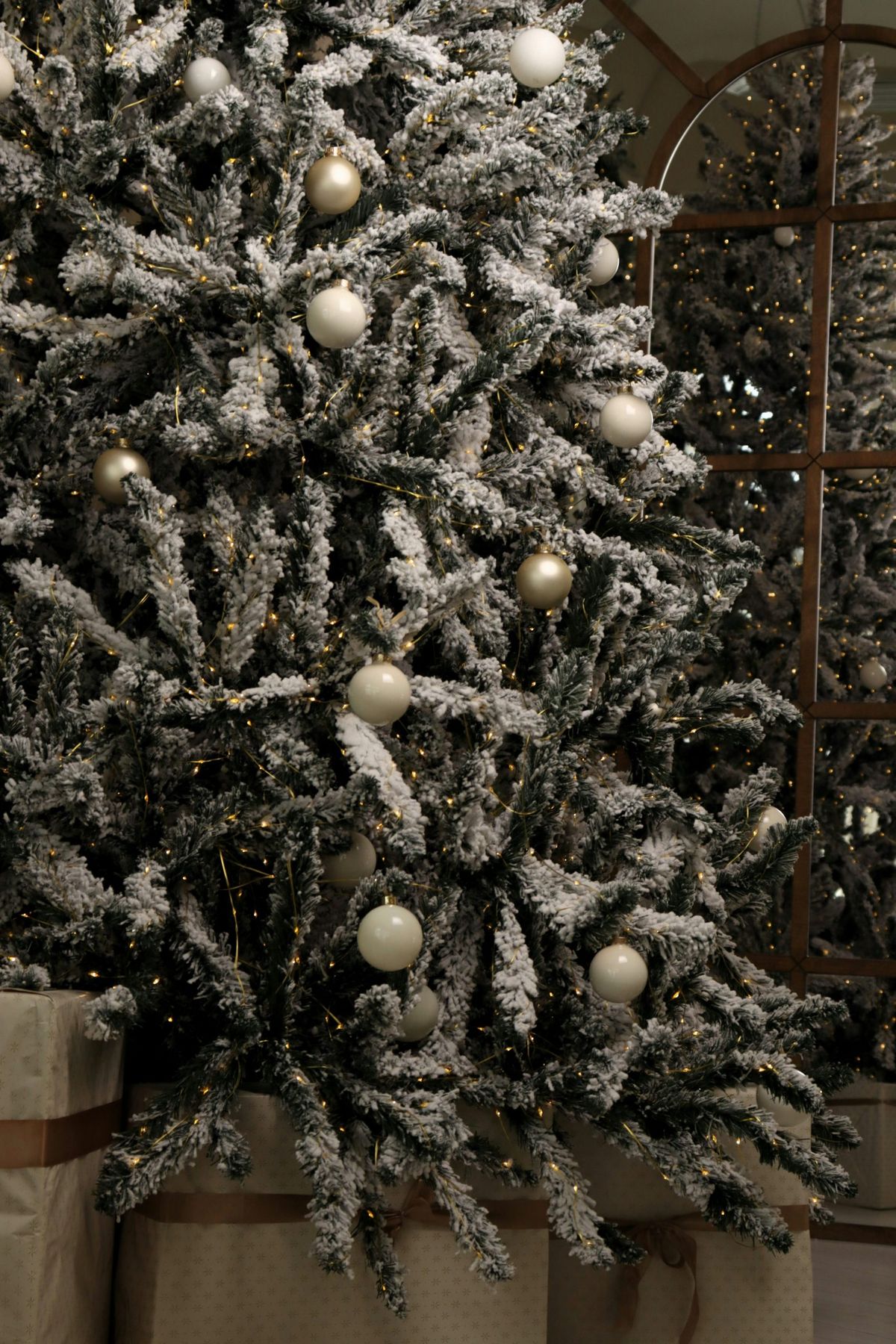Frosted christmas tree with white ornaments and lights - Free Photo on  Unsplash