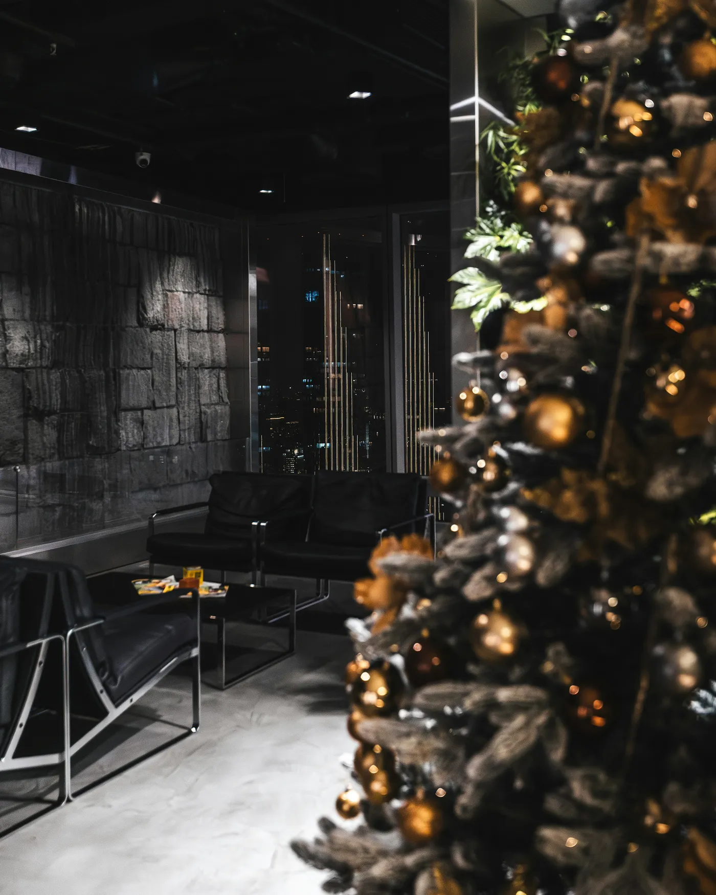 Modern lounge with christmas tree and city view